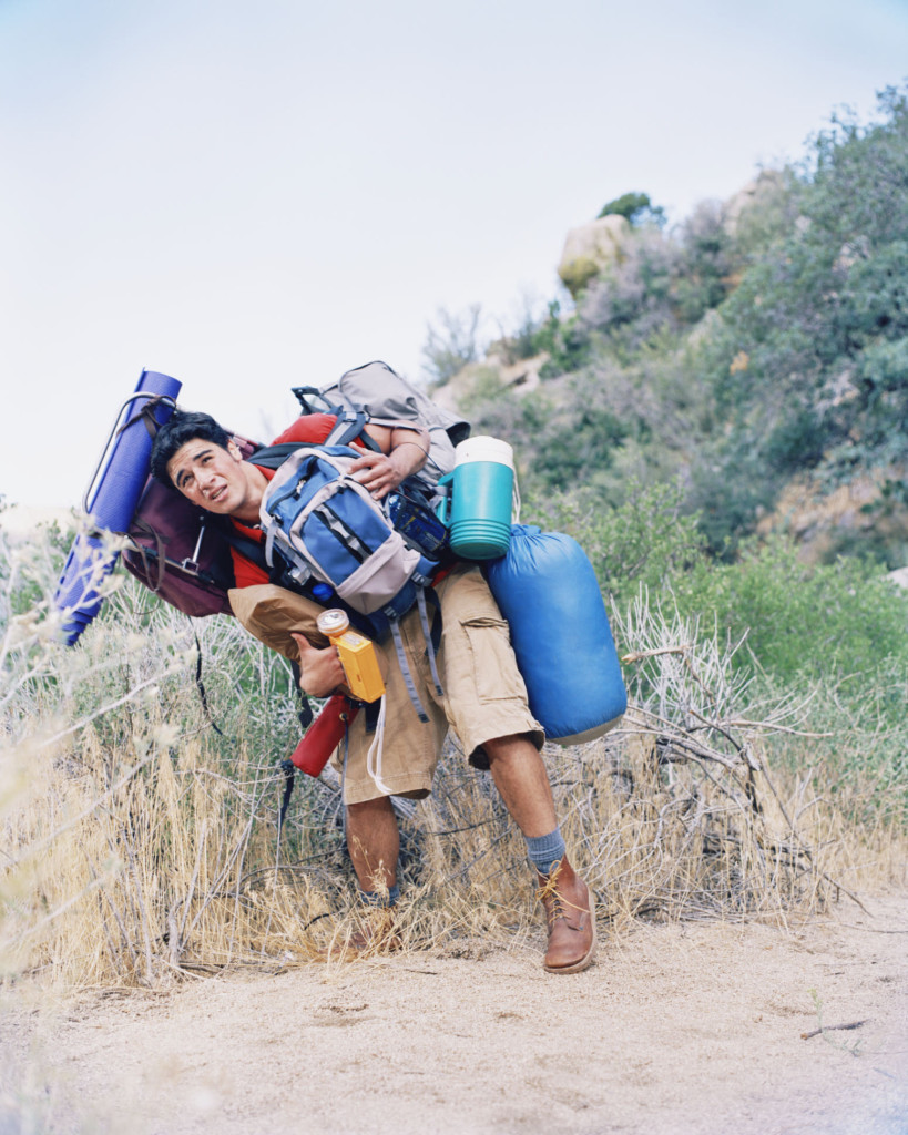 young-man-carrying-way-too-much-backpacking-gear-heavy-backpack-Shannon-Fagan